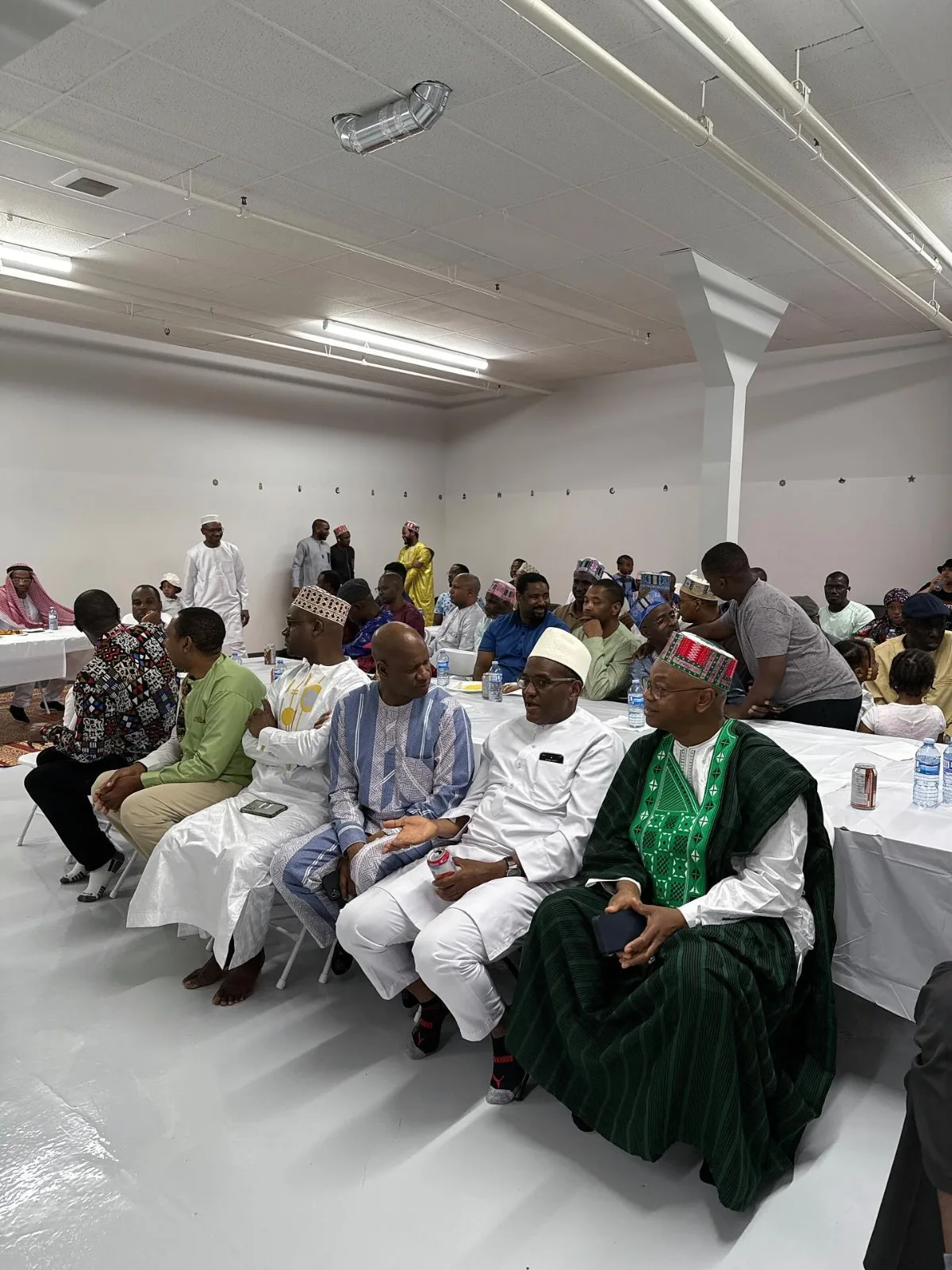 An assembly gathered in the centre's hall.