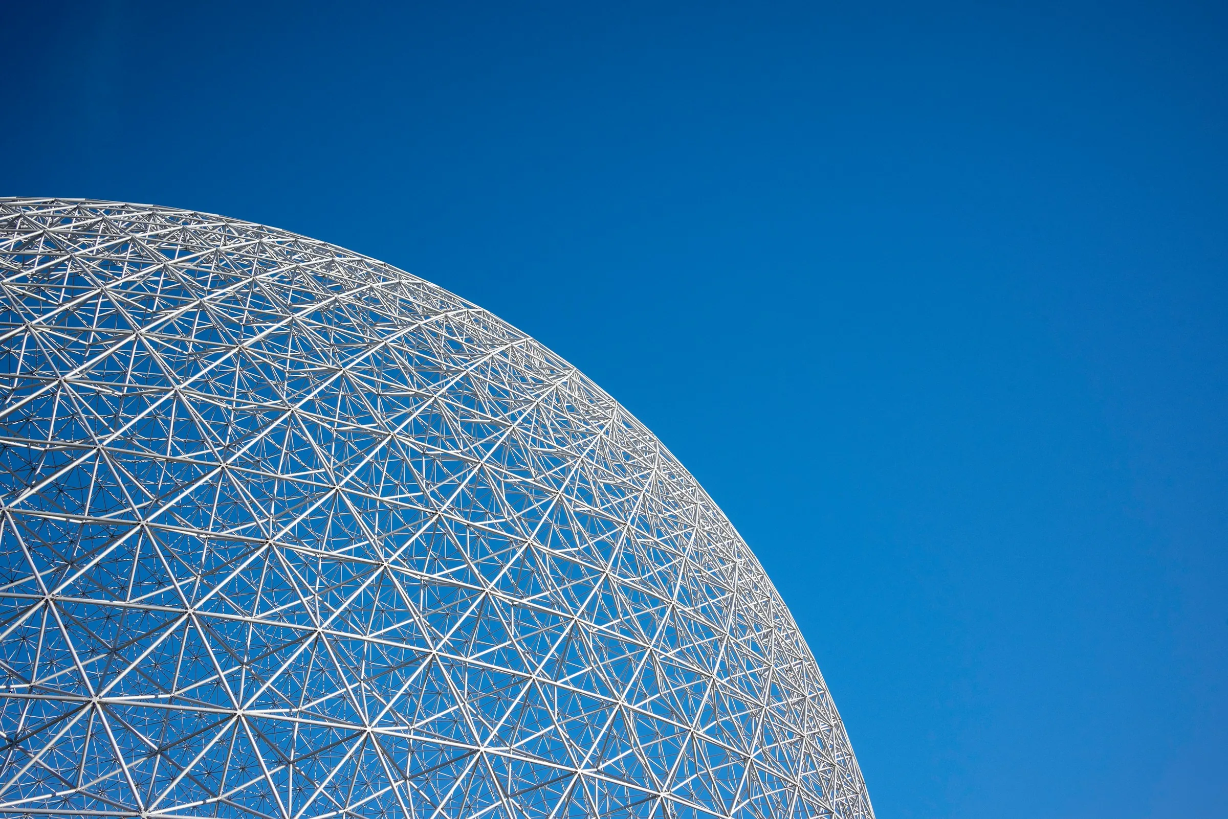 Montréal’s Biosphère, its geodesic dome against a blue sky.