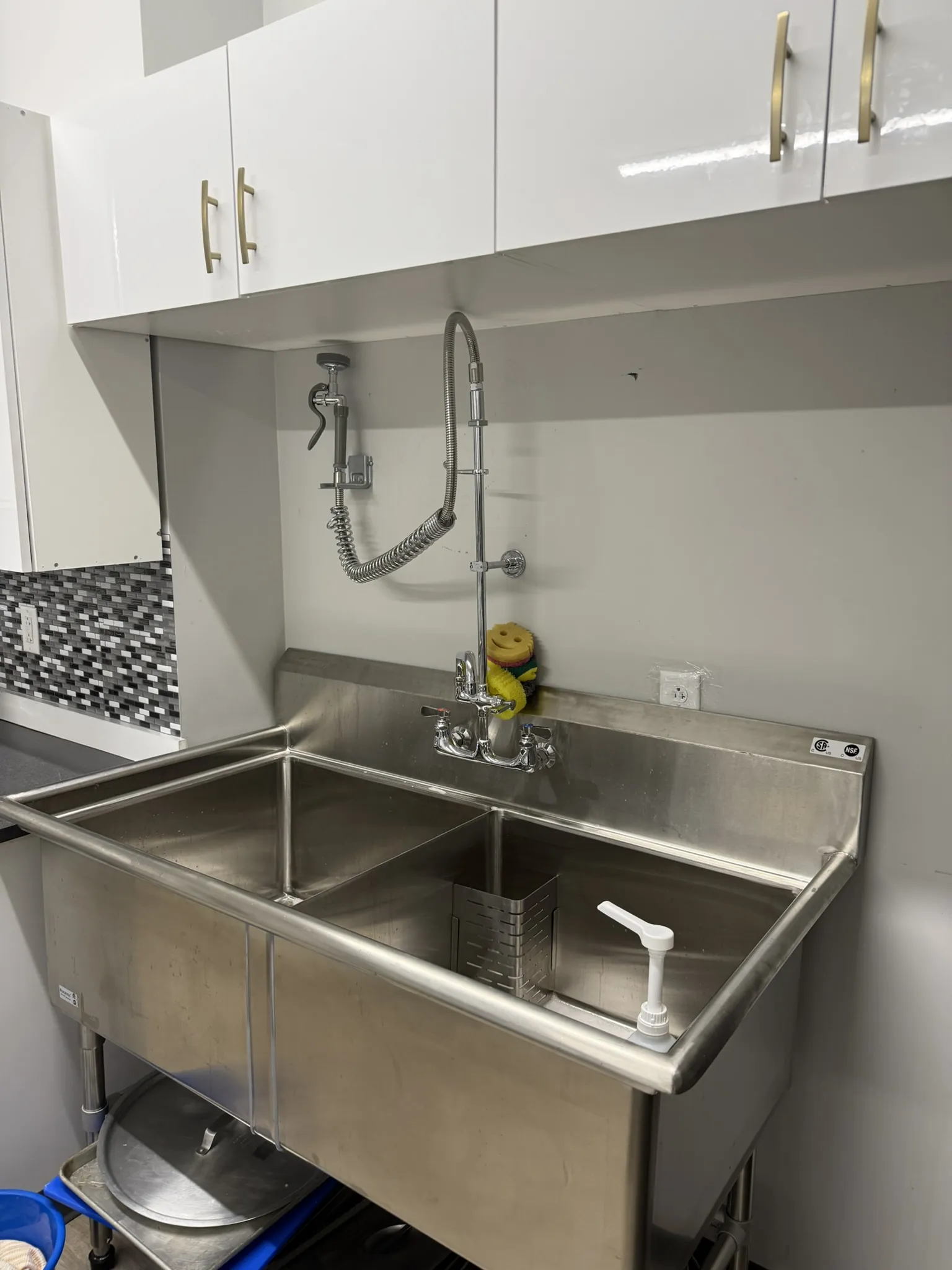 The commercial sink in the kitchen.